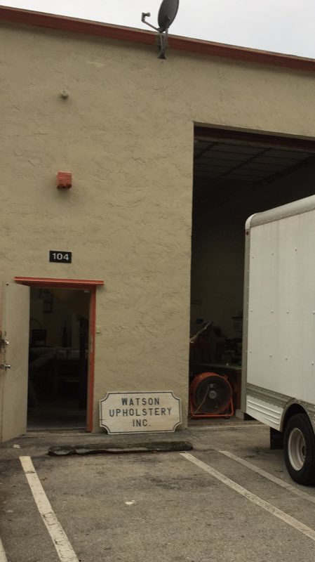 Watson Upholstery Inc. shop exterior with the company sign at Unit 104